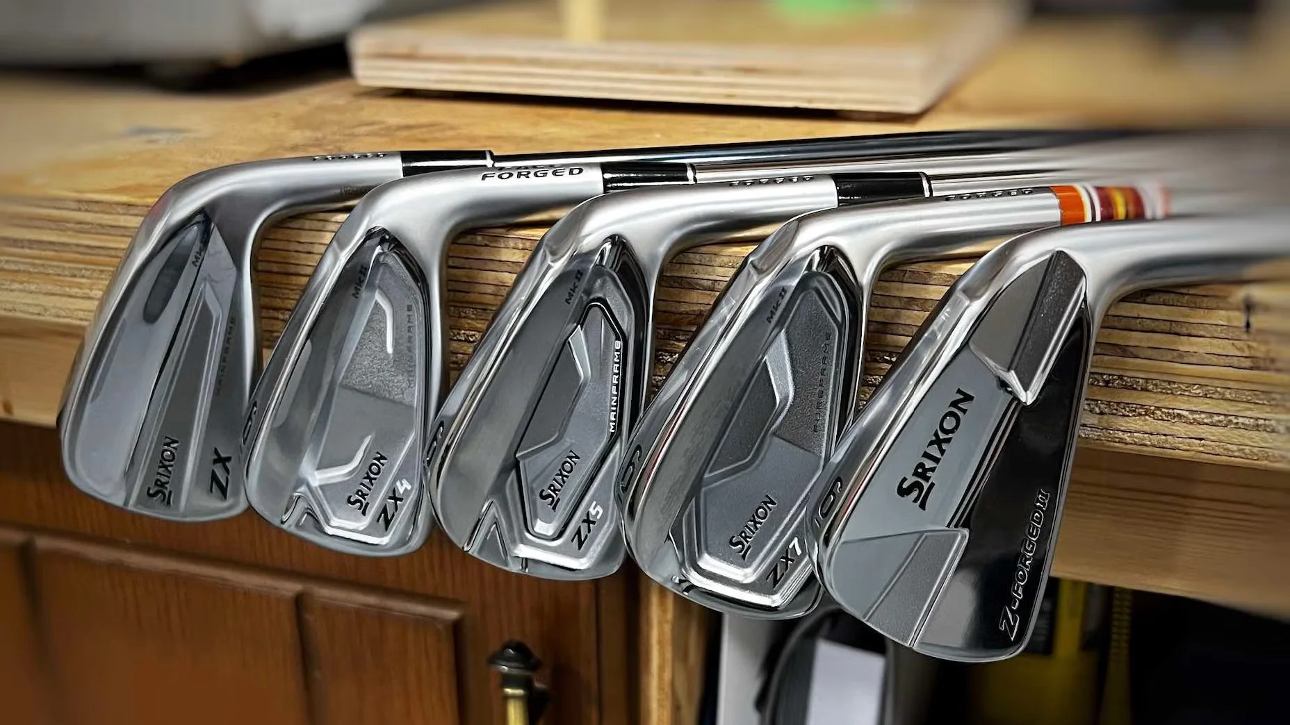 Complete set of golf irons numbered from long iron to short iron, the workhorse clubs for approach shots